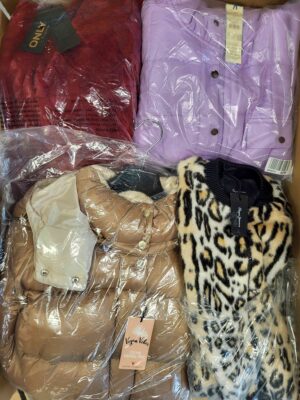 The photo shows a package with clothing in the category AJW.