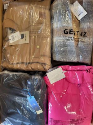 The photo shows a package with clothing in the category AJW.