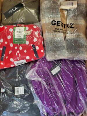 The photo shows a package with clothing in the category AJW.
