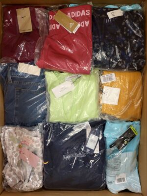 The photo shows a package with clothing in the category AW.
