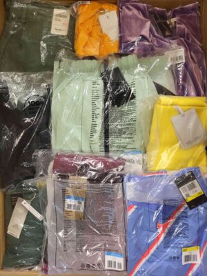 The photo shows a package with clothing in the category AW.