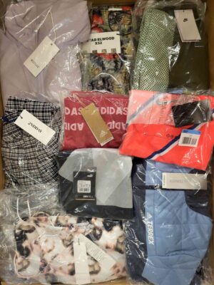 The photo shows a package with clothing in the category AW.