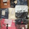 The photo shows a package with clothing in the category AW.