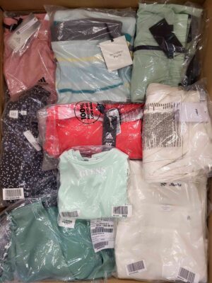 The photo shows a package with clothing in the category AW.
