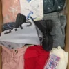 The photo shows a package with clothing in the category SN.