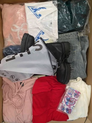 The photo shows a package with clothing in the category SN.