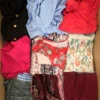 The photo shows a package with clothing in the category SN.