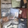 The photo shows a package with clothing in the category AP.