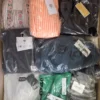 The photo shows a package with clothing in the category AP.