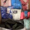 The photo shows a package with clothing in the category AP.