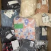 The photo shows a package with clothing in the category AP.