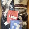 The photo shows a package with clothing in the category YA.