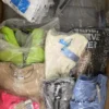 The photo shows a package with clothing in the category AP.