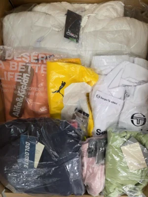 The photo shows a package with clothing in the category AP.