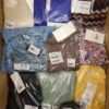 The photo shows a package with clothing in the category YA.