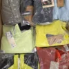 The photo shows a package with footwear in the category AS.
