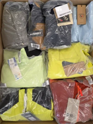 The photo shows a package with footwear in the category AS.