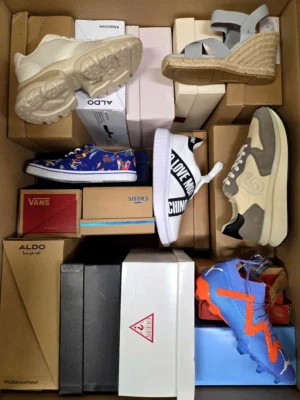 The photo shows a package with footwear in the category AS.
