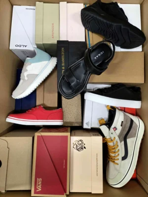 The photo shows a package with footwear in the category AS.