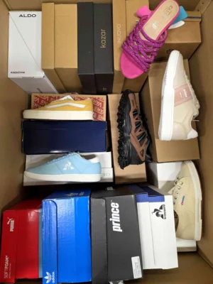 The photo shows a package with footwear in the category AS.