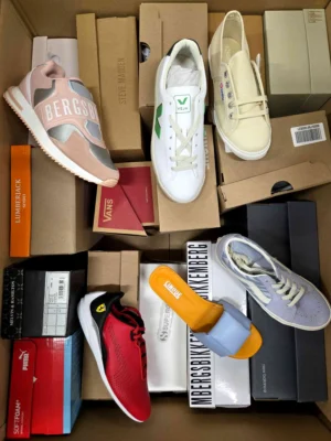 The photo shows a package with footwear in the category AS.
