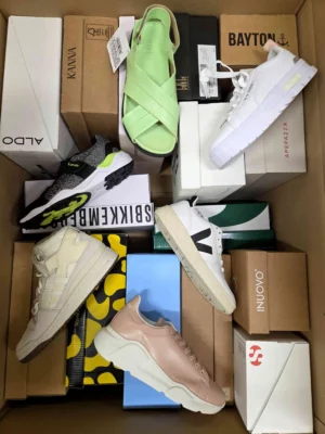The photo shows a package with footwear in the category AS.