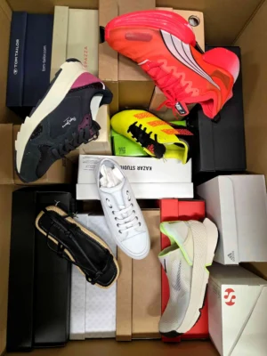 The photo shows a package with footwear in the category AS.