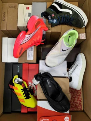 The photo shows a package with footwear in the category AS.