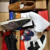 The photo shows a package with footwear in the category AS.
