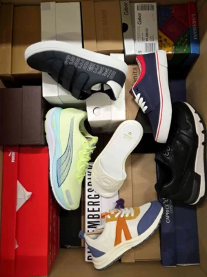The photo shows a package with footwear in the category AS.