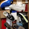 The photo shows a package with footwear in the category AS.