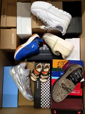 The photo shows a package with footwear in the category AS.