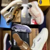 The photo shows a package with footwear in the category AS.