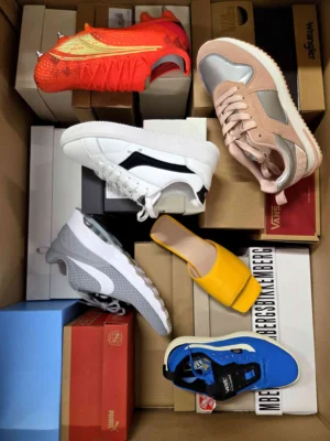 The photo shows a package with footwear in the category AS.