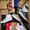 The photo shows a package with footwear in the category AS.