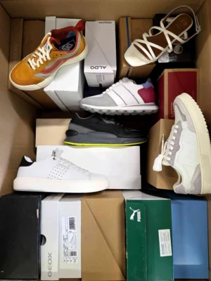 The photo shows a package with footwear in the category AS.