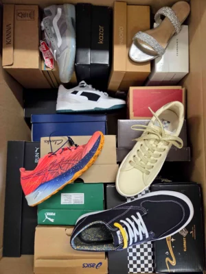 The photo shows a package with footwear in the category AS.