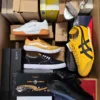 The photo shows a package with footwear in the category AS.