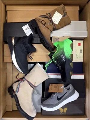 The photo shows a package with footwear in the category AS.