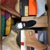 The photo shows a package with footwear in the category AS.