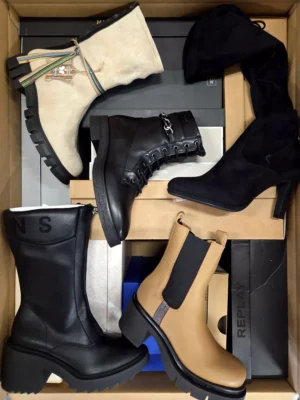 The photo shows a package with footwear in the category AS.