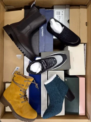 The photo shows a package with footwear in the category AS.