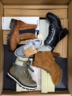The photo shows a package with footwear in the category AS.