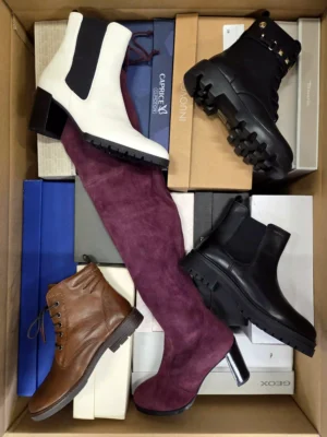 The photo shows a package with footwear in the category AS.