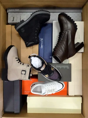 The photo shows a package with footwear in the category AS.
