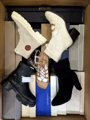 The photo shows a package with footwear in the category AS.
