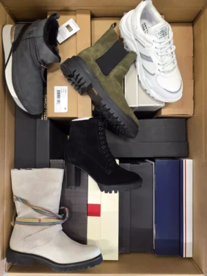 The photo shows a package with footwear in the category AS.