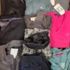 The photo shows a package with clothing in the category U.