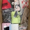 AU327 1 The photo shows a package with clothing in the category AU.