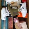 The photo shows a package with footwear in the category BS.